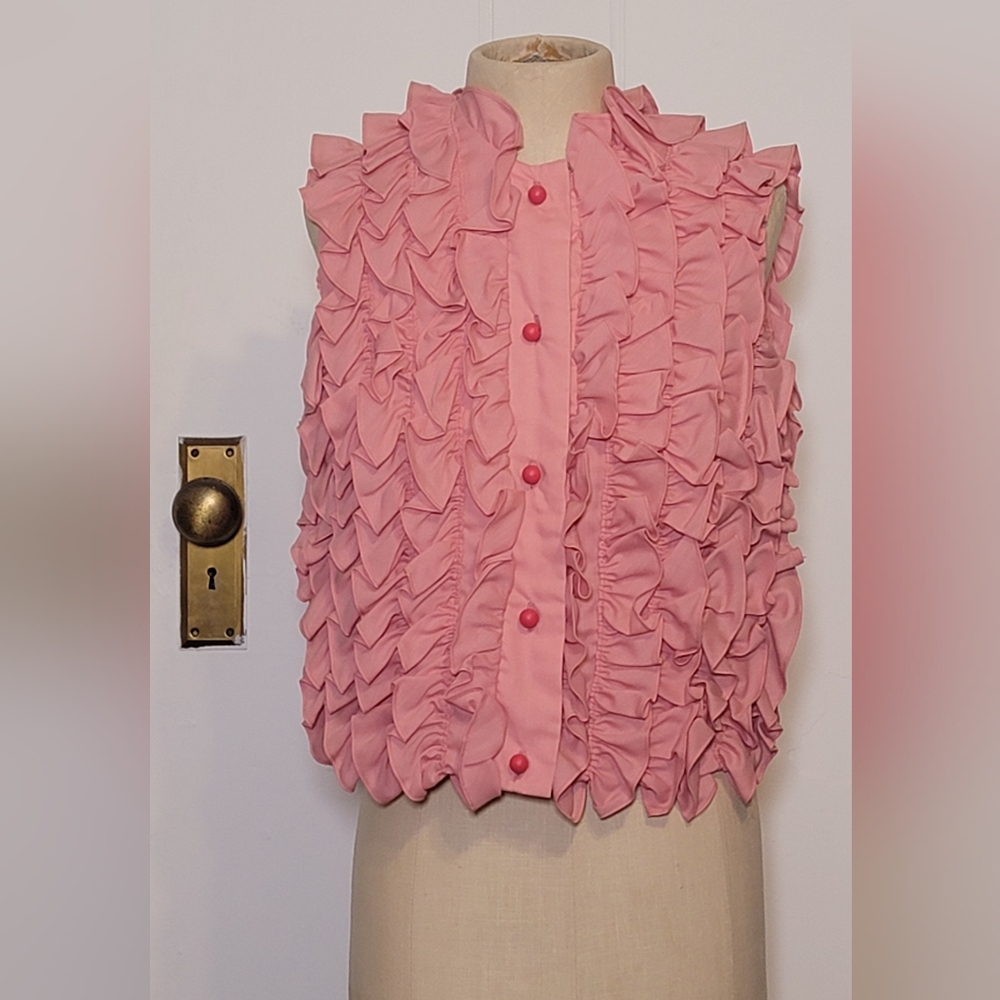 Pink vintage top with ruffles and round wooden buttons.